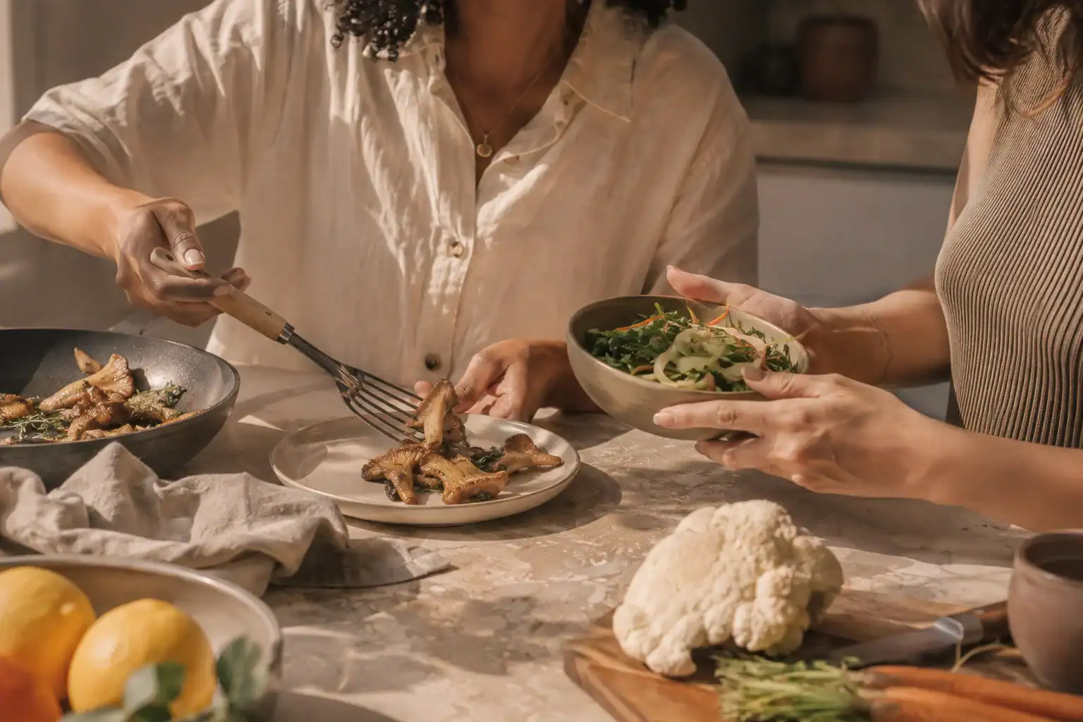 Two adults preparing a balanced meal with culinary mushrooms and vegetables