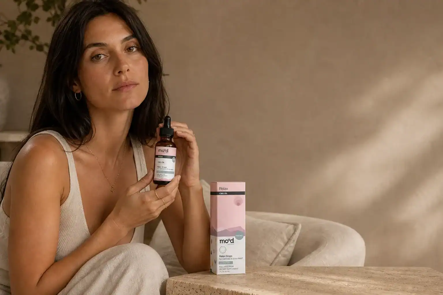 Two women share a creative afternoon with Mood Daily Bliss gummies nearby