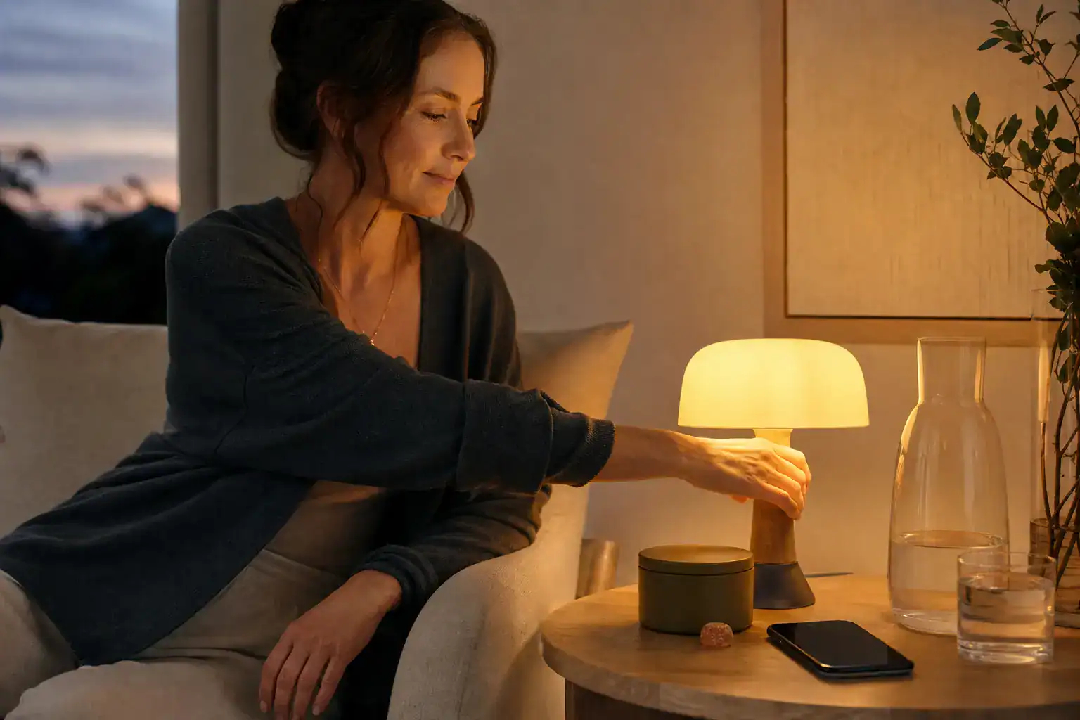 Adult including a measured gummy in a calm evening routine without implying treatment